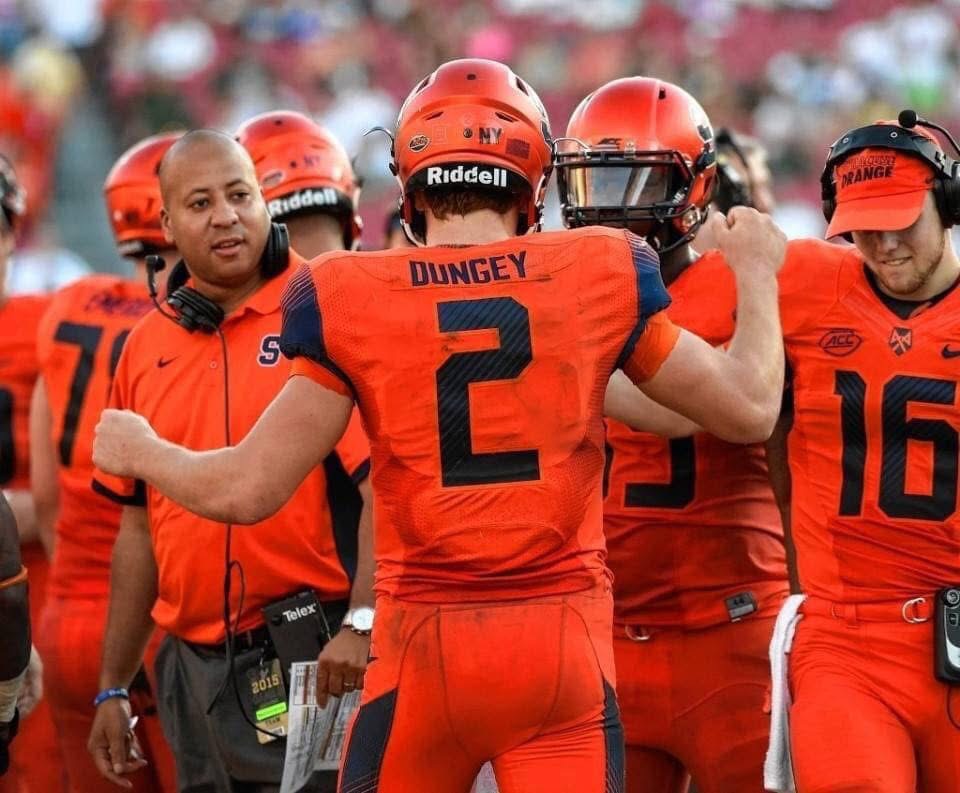 Coach Acosta on the sideline coaching Syracuse players